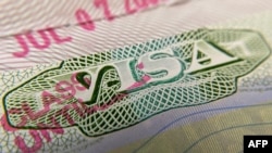 This photo illustration shows a visa stamp on a foreign passport in Los Angeles on June 6, 2020. - The United States said July 6 it would not allow foreign students to remain in the country if all of their classes are moved online.