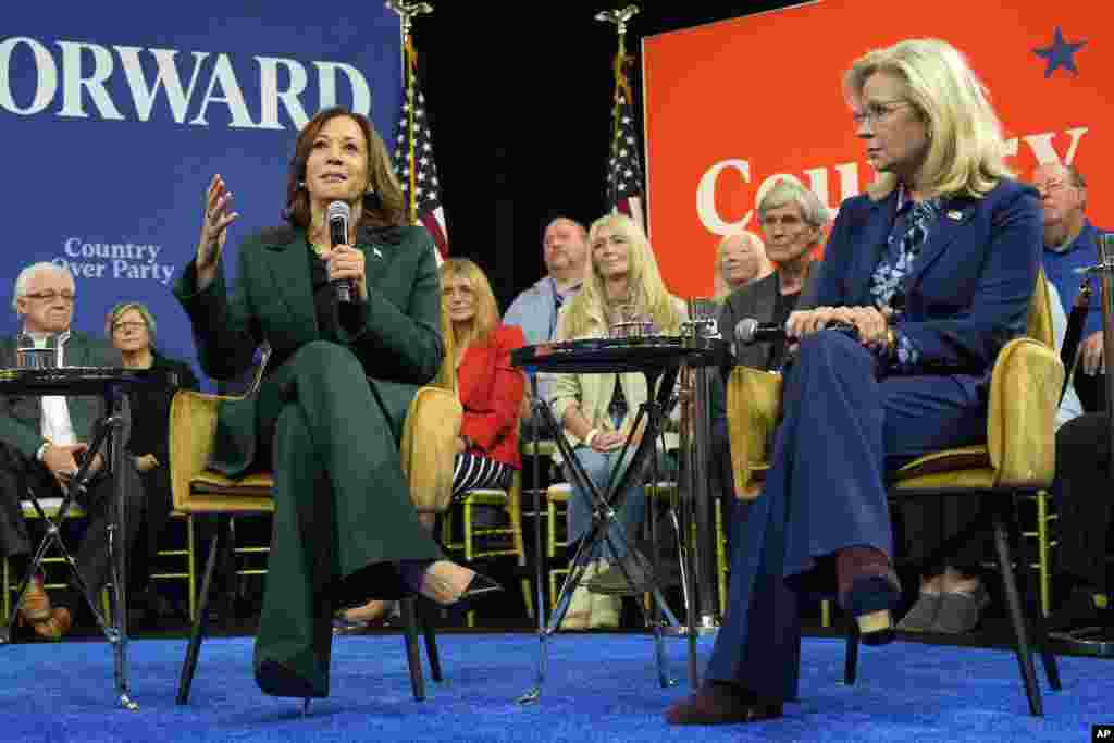 Democratic presidential nominee Vice President Kamala Harris, left, speaks as former Republican Congresswoman Liz Cheney listens during a town hall at The People's Light in Malvern, Pennsylvania.