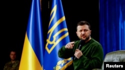 Президент України Володимир Зеленський виступає під час форуму "Україна. Рік 2024", у Києві, 25 лютого 2024 року. (Фото: REUTERS/Валентин Огіренко)