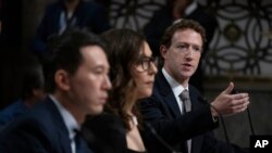 Meta CEO Mark Zuckerberg, right, with fellow witnesses, from left, TikTok CEO Shou Zi Chew and X CEO Linda Yaccarino, testifies before a Senate Judiciary Committee hearing on Capitol Hill in Washington, Jan. 31, 2024, to discuss child safety online.