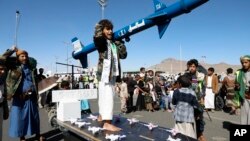 Houthi supportsers attend a rally against the U.S.-led strikes on Yemen and Israel's war in Gaza Strip, in Sanaa, Yemen, Feb. 23, 2024. 