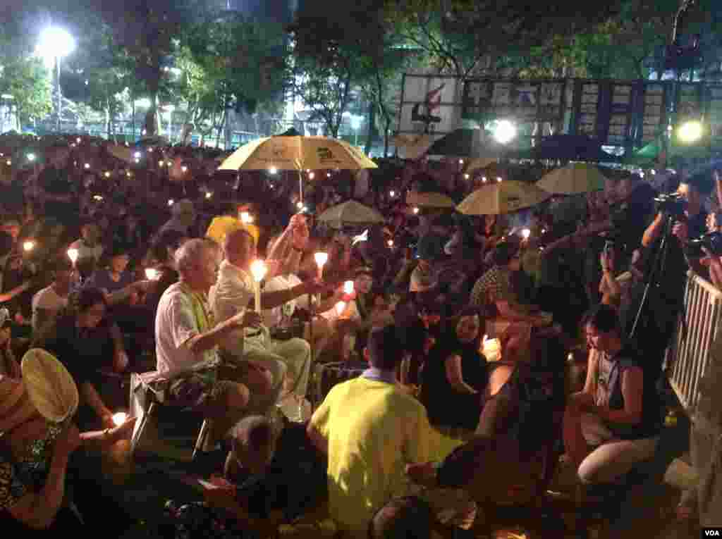 Thousands of people attend an annual candlelight vigil at the Victoria Park in Hong Kong, June 4, 2015 to mark Beijing's Tiananmen Square crackdown in 1989.