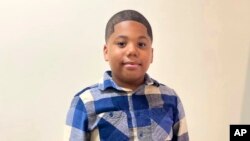 11-godišnji Aderijen Mari, na fotografiji snimljenoj u decembru 2022, koju je njegova majka dostavila agenciji Rojters. 