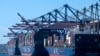 Cargo containers sit stacked on ships at the Port of Los Angeles, Oct. 20, 2021 in San Pedro, California.
