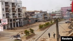 FILE - Soldiers clear a road in Bamenda, Cameroon, Dec. 8, 2016.