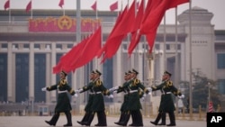 Chinese soldiers march to their post outside the Great Hall of the People in Beijing, March 7, 2025. 