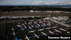 FILE PHOTO: Boeing 737 Max aircraft are parked in a parking lot at Boeing Field in this aerial photo taken over Seattle