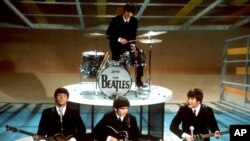 FILE - In this Feb. 9, 1964 file photo, The Beatles perform on the CBS "Ed Sullivan Show" in New York.