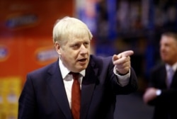 Britain's Prime Minister Boris Johnson visits Bestway Wholesale in Manchester, Britain, Sept. 30, 2019.