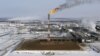 FILE PHOTO: A flame burns from a tower at Vankorskoye oil field owned by Rosneft company north of the Russian Siberian city of Krasnoyarsk