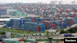 FILE - A container port in Shanghai, Aug. 11, 2009. China's trade surplus with the United States rose in June, but analysts are expecting a less favorable trade balance for China in the coming months.