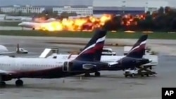 This image taken from video provided by Instagram user @artempetrovich, shows the SSJ-100 aircraft of Aeroflot Airlines on fire during an emergency landing in Sheremetyevo airport in Moscow, Russia, May 5, 2019. 
