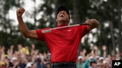 Tiger Woods reacts as he wins the Masters golf tournament Sunday, April 14, 2019, in Augusta, Ga. 