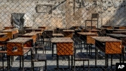 FILE - The benches of a school sit empty in Kabul, Afghanistan, Dec. 22, 2022. A Taliban decree that reportedly took effect Dec. 3, 2024, bans medical schools in Afghanistan from admitting female students.