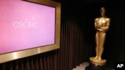 FILE - A giant Oscar statue is seen at The Oscars Greenroom in Los Angeles, California, Feb. 22, 2017. (Photo by Matt Sayles/Invision/AP, File)