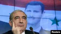 Qadri Jamil, Syria's deputy prime minister for economic affairs, listens during a news conference in Moscow, August 21, 2012. 