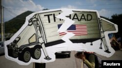 FILE - Protesters attend an anti-THAAD proest in Seongju, South Korea.