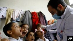 Syrian children receive vaccination against polio at a Syrian refugee camp in Lebanon, Nov. 7, 2013.