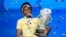 FILE - Zaila Avant-garde, 14, from Harvey, La., celebrates with the championship trophy after winning the finals of the 2021 Scripps National Spelling Bee at Disney World, July 8, 2021, in Lake Buena Vista, Fla. 