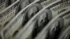 FILE PHOTO: A picture illustration shows U.S. 100 dollar bank notes taken in Tokyo