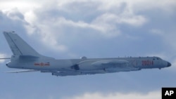 In this photo released by the Taiwan Ministry of National Defense, a Chinese People's Liberation Army H-6 bomber fitted with the YJ-12 anti-ship cruise missile is seen flying near the Taiwan air defense identification zone near Taiwan on Friday.
