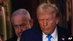 FILE - U.S. President Donald Trump and Israeli Prime Minister Benjamin Netanyahu arrive for a news conference in the White House on Feb. 4, 2025, in Washington.