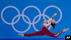 FILE - In this July 25, 2021, file photo, Pauline Schaefer-Betz, of Germany, performs her floor exercise routine during the women's artistic gymnastic qualifications at the 2020 Summer Olympics, in Tokyo. (AP Photo/Gregory Bull, File)