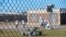 FILE - Detainees sit in a yard during a media tour inside the Winn Correctional Center in Winnfield, La. 