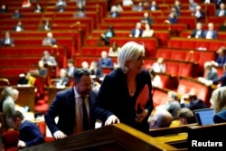 FILE - French far-right leader and member of parliament Marine Le Pen arrives for a vote on a no-confidence motion against the French government, at the National Assembly in Paris on Dec. 4, 2024.