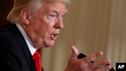 FILE - President Donald Trump speaks in the East Room of the White House in Washington. 