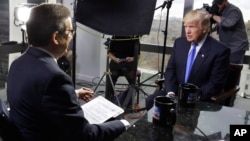 FILE - President-elect Donald Trump, right, is interviewed by Chris Wallace of "Fox News Sunday" at Trump Tower in New York, Dec. 10, 2016.