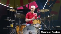 FILE PHOTO: Charlie Watts of British rock band The Rolling Stones performs with his band members Mick Jagger, Keith Richards, and Ronnie Wood at a 2016 concert in Santiago, Chile.