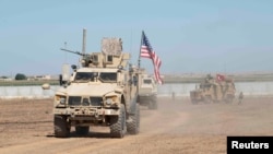 U.S. and Turkish military forces conduct a joint ground patrol inside the security mechanism area in northeast, Syria, September 8, 2019. Picture taken September 8, 2019. U.S. Army/Spc. Alec Dionne/Handout via REUTERS. THIS IMAGE HAS BEEN SUPPLIED BY A THIRD PARTY.