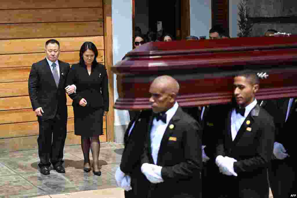 Employees from a funeral parlor carry the coffin of late Peru's former president Alberto Fujimori in front of Fujimori's children Kenji and Keiko, to take it to the Ministry of Culture for his wake in Lima.&nbsp;Fujimori, who ruled his country with an iron fist and then spent 16 years in prison for crimes against humanity, died on Sept. 11, 2024, at age 86 in the capital.&nbsp;