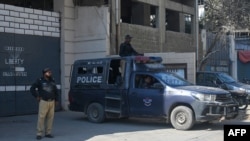 Pakistani policemen stand guard outside a factory where two Chinese nationals were allegedly shot, in Karachi, Nov. 5, 2024. China said on Nov. 19, 2024, it will send troops to Pakistan for the first joint counterterrorism exercise in five years to enhance security cooperation.